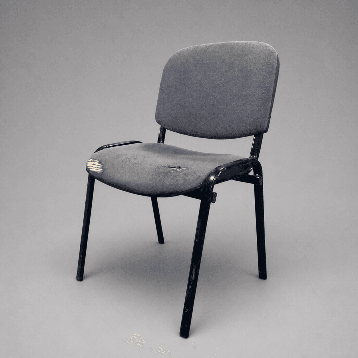 Worn grey upholstered chair — Photo 1